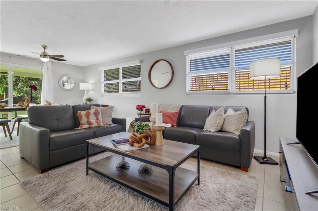 751 100th Avenue North Naples, FL 34108 - Photo 20 of 34 a living room with furniture a rug and a window