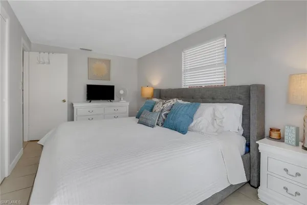 a large white bed in a white room