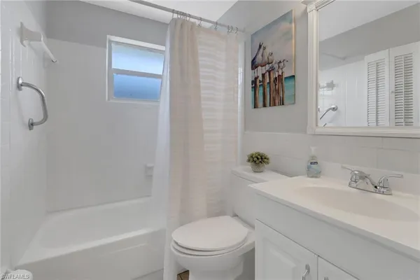 a bathroom with a sink a toilet and a bathtub