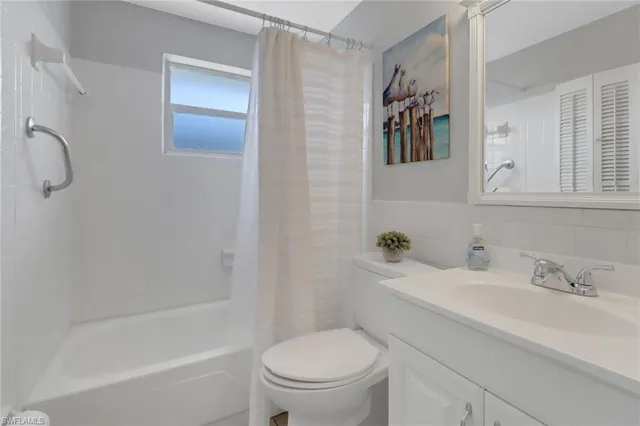 a bathroom with a sink a toilet and a bathtub