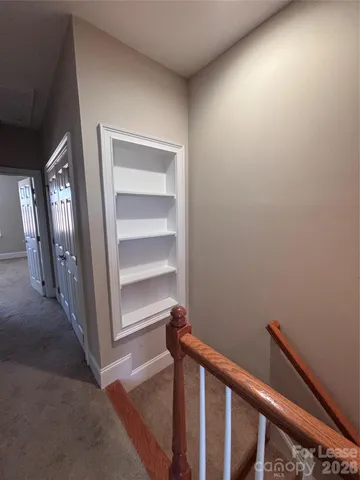 a view of a hallway with closet