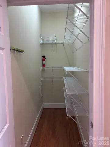 a view of storage and utility room with empty racks