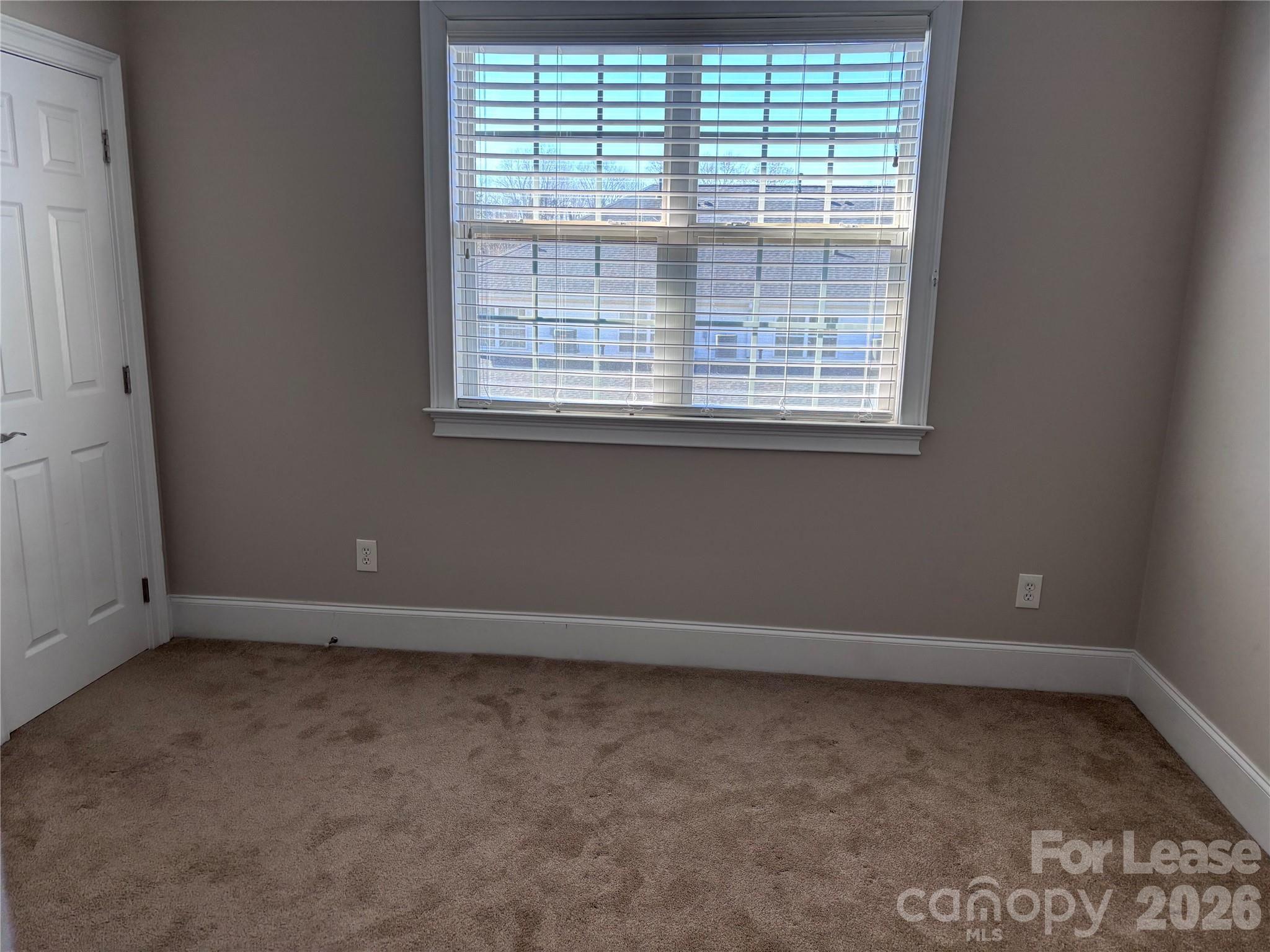 373 Dumbarton Street Concord, NC 28027 - Photo 16 of 18 an empty room with a window