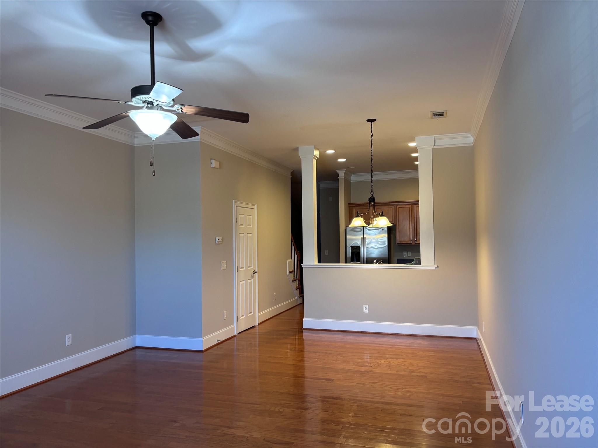 373 Dumbarton Street Concord, NC 28027 - Photo 3 of 18 a view of a livingroom with a chandelier fan and windows