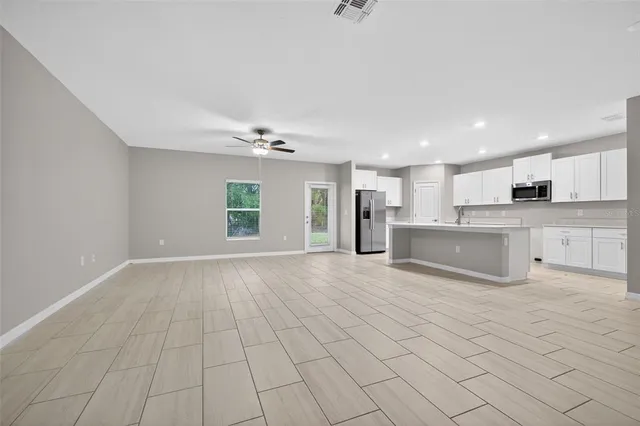 a kitchen with a sink cabinets and stainless steel appliances