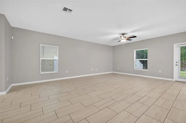a kitchen with white cabinets sink and appliances