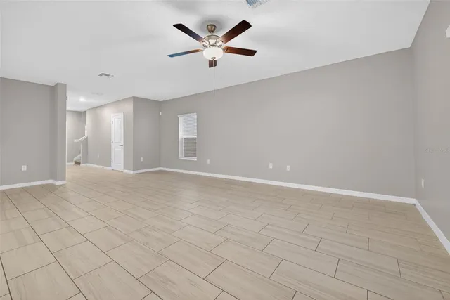 a kitchen with white cabinets appliances and sink
