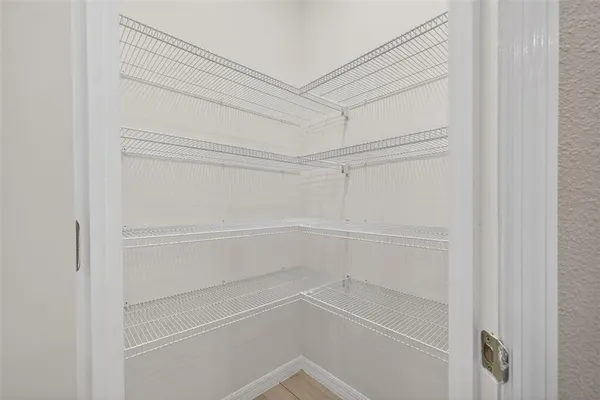 a view of an empty walk in closet