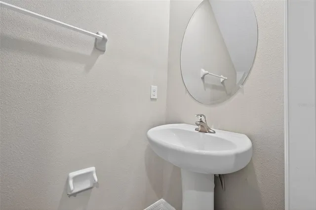 a bathroom with a double vanity sink and mirror