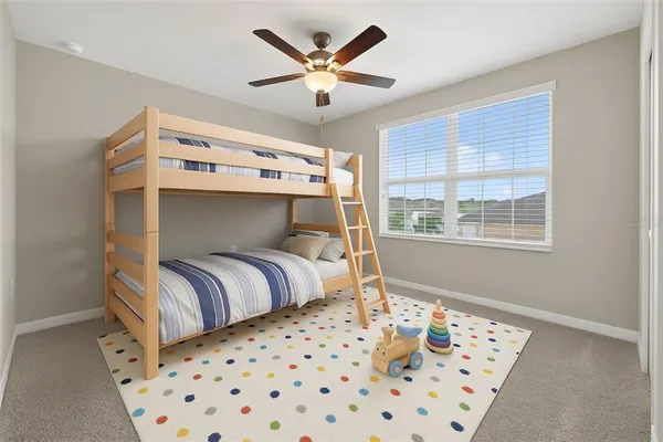 a bedroom with a bed and window