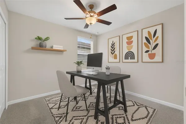 a view of a workspace with furniture