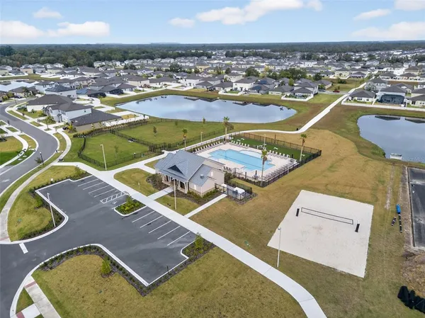 an aerial view of a house with a swimming pool