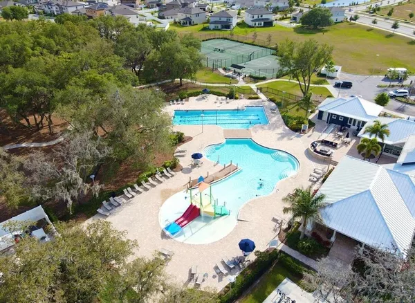 an aerial view of residential houses with outdoor space