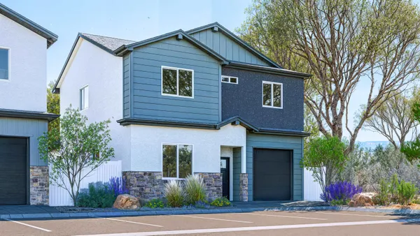 a front view of a house with a yard garage and garage