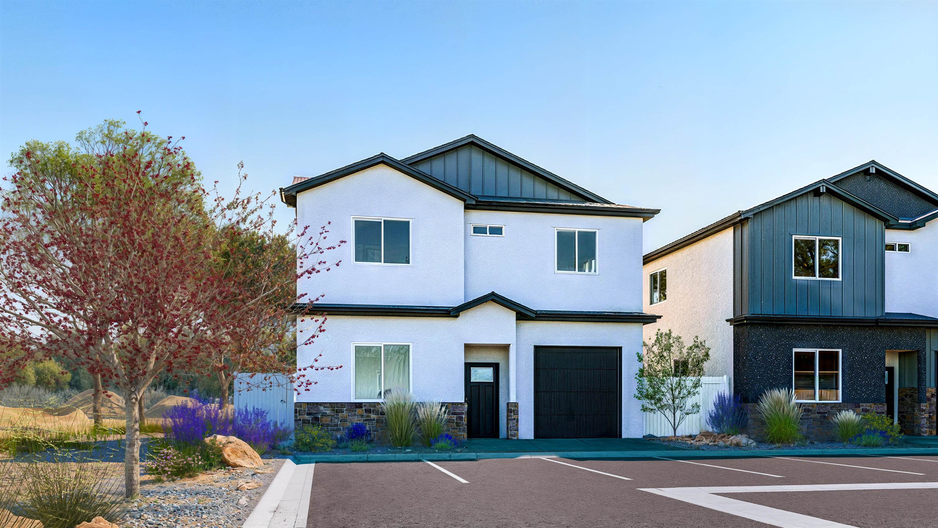 443 Clements Way Fruita, CO 81521 - Photo 2 of 13 a front view of a house with yard and garage