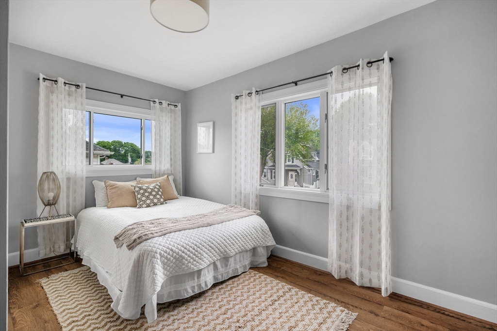 8 Baker Avenue Beverly, MA 01915 - Photo 18 of 40 a bedroom with a bed and a window