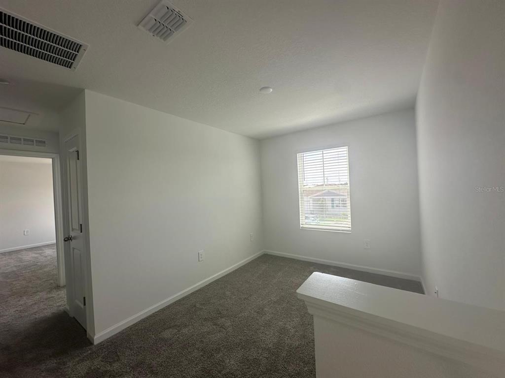 1559 Marksman Road Eagle Lake, FL 33839 - Photo 12 of 17 an empty room with a window