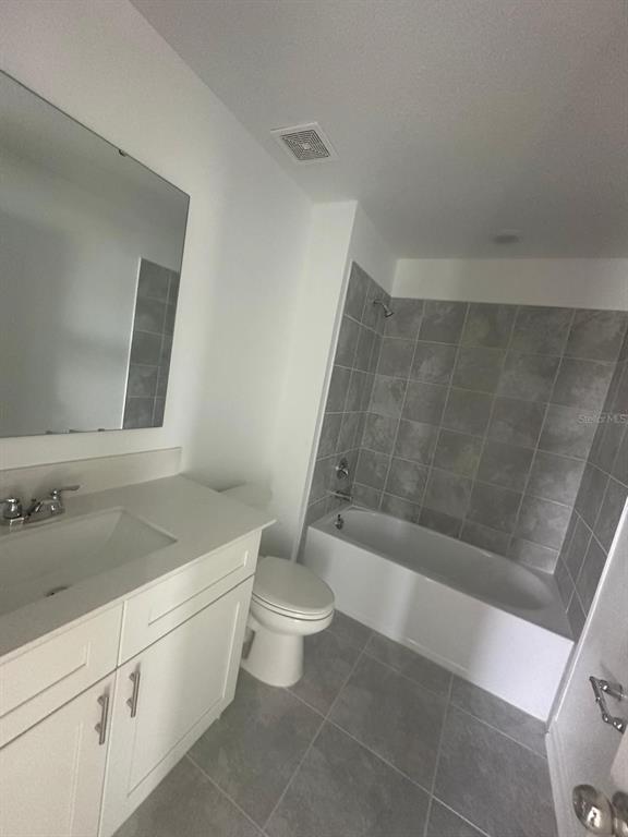 1559 Marksman Road Eagle Lake, FL 33839 - Photo 14 of 17 a bathroom with a granite countertop sink toilet and shower