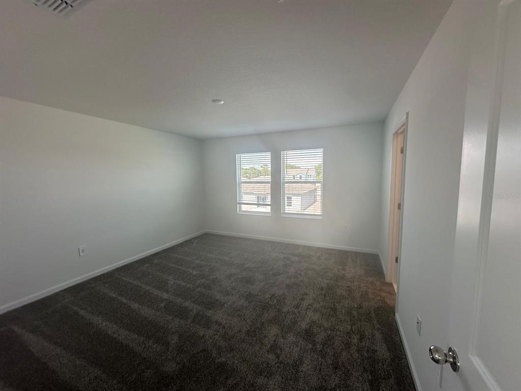 1559 Marksman Road Eagle Lake, FL 33839 - Photo 16 of 17 an empty room with a window