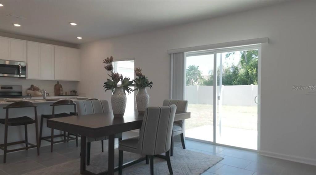 1559 Marksman Road Eagle Lake, FL 33839 - Photo 5 of 17 a dining room with furniture and window