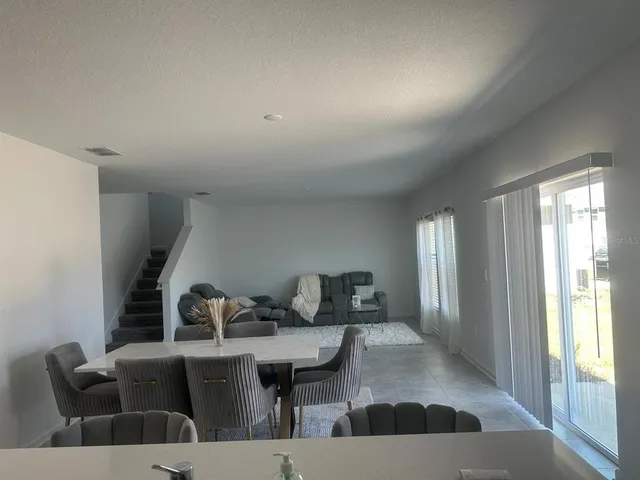 a view of a livingroom with furniture and window
