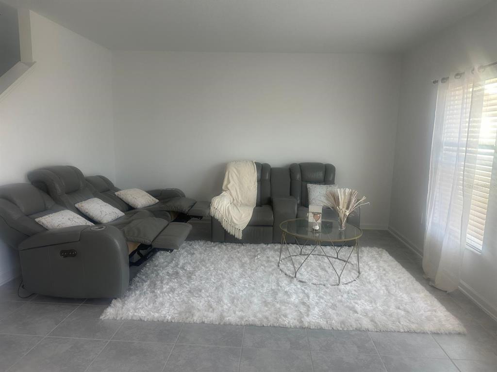 1559 Marksman Road Eagle Lake, FL 33839 - Photo 7 of 17 a living room with furniture and a window