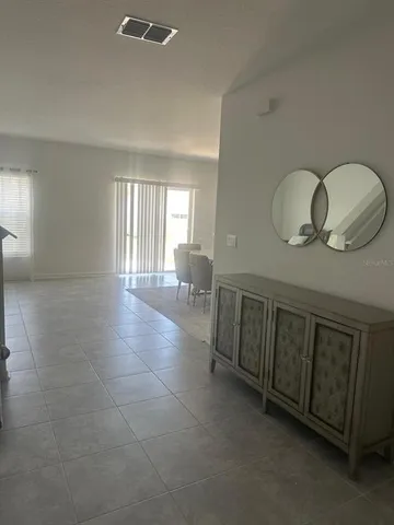 a view of a hallway with closet