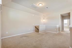 407 Epiphany Lane Pflugerville, TX 78660 - Photo 13 of 29 Spare room featuring light carpet and baseboards