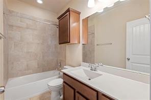 407 Epiphany Lane Pflugerville, TX 78660 - Photo 21 of 29 Full bath featuring vanity and bathing tub / shower combination