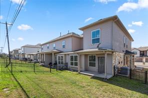 407 Epiphany Lane Pflugerville, TX 78660 - Photo 29 of 29 Back of property with a fenced backyard, a patio area, and stone siding