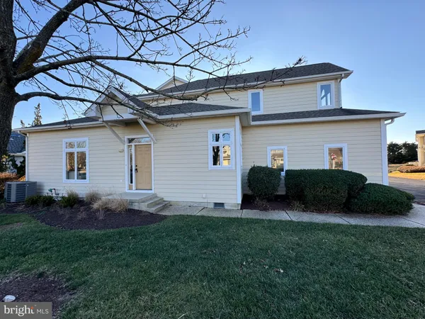 a view of a backyard with plants and a barbeque