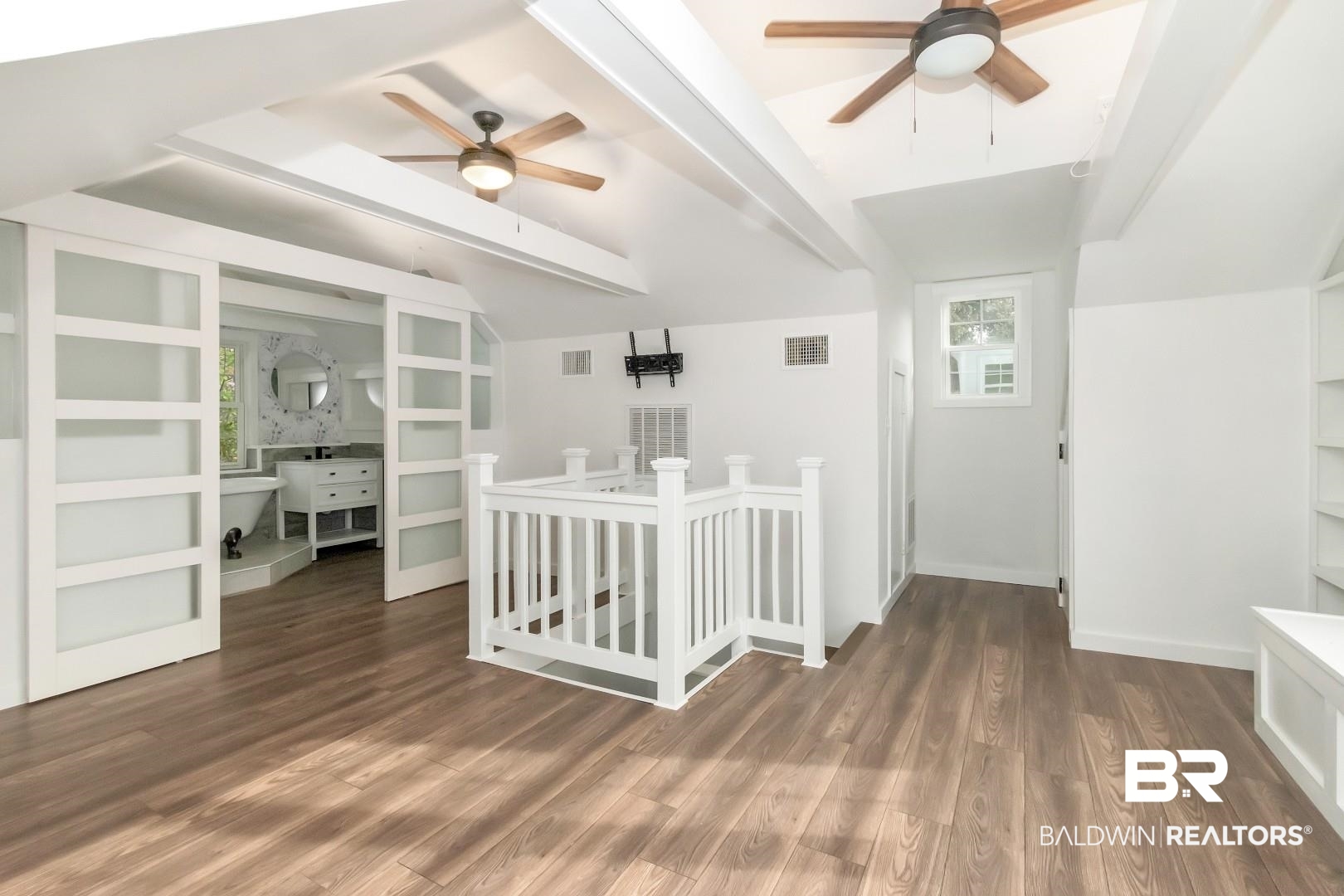 2157 Homewood Street Mobile, AL 36606 - Photo 18 of 36 Interior space with lofted ceiling with beams, visible vents, and wood finished floors