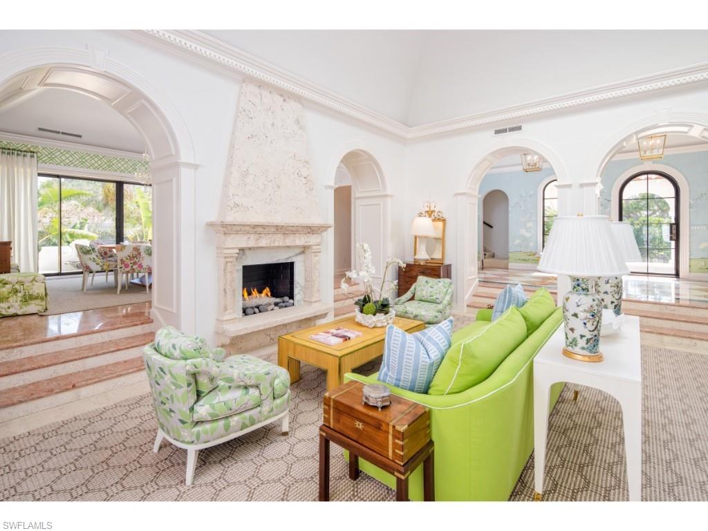 777 Kingstown Drive Naples, FL 34102 - Photo 2 of 18 a living room with fireplace furniture and a fireplace