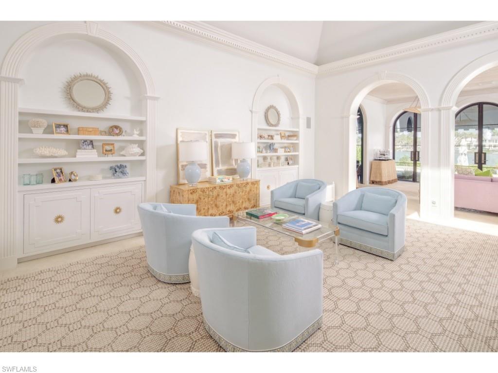 777 Kingstown Drive Naples, FL 34102 - Photo 3 of 18 a living room with furniture a rug and white walls