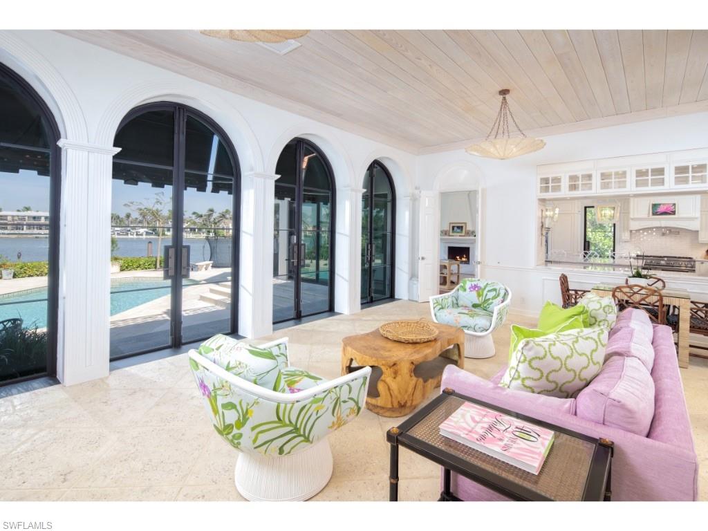 777 Kingstown Drive Naples, FL 34102 - Photo 8 of 18 a living room with patio furniture and a large window
