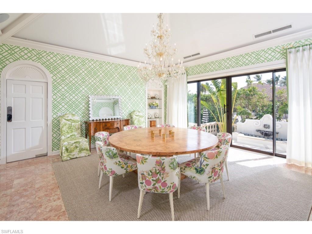 777 Kingstown Drive Naples, FL 34102 - Photo 9 of 18 a dining room with furniture a livingroom and chandelier