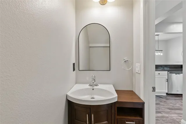 a bedroom with a bed and a rug