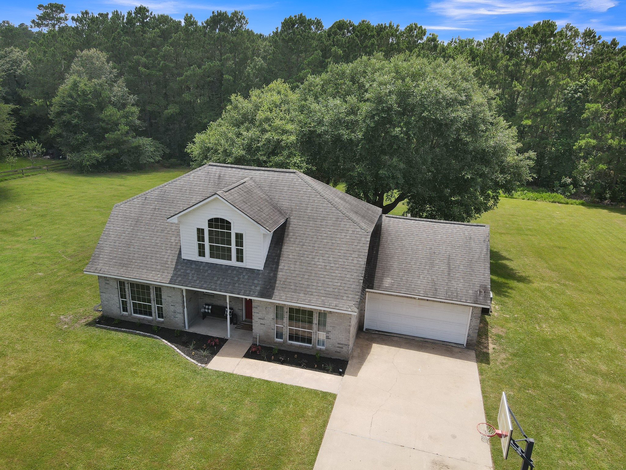 Welcome home to private country living on 5 acres!