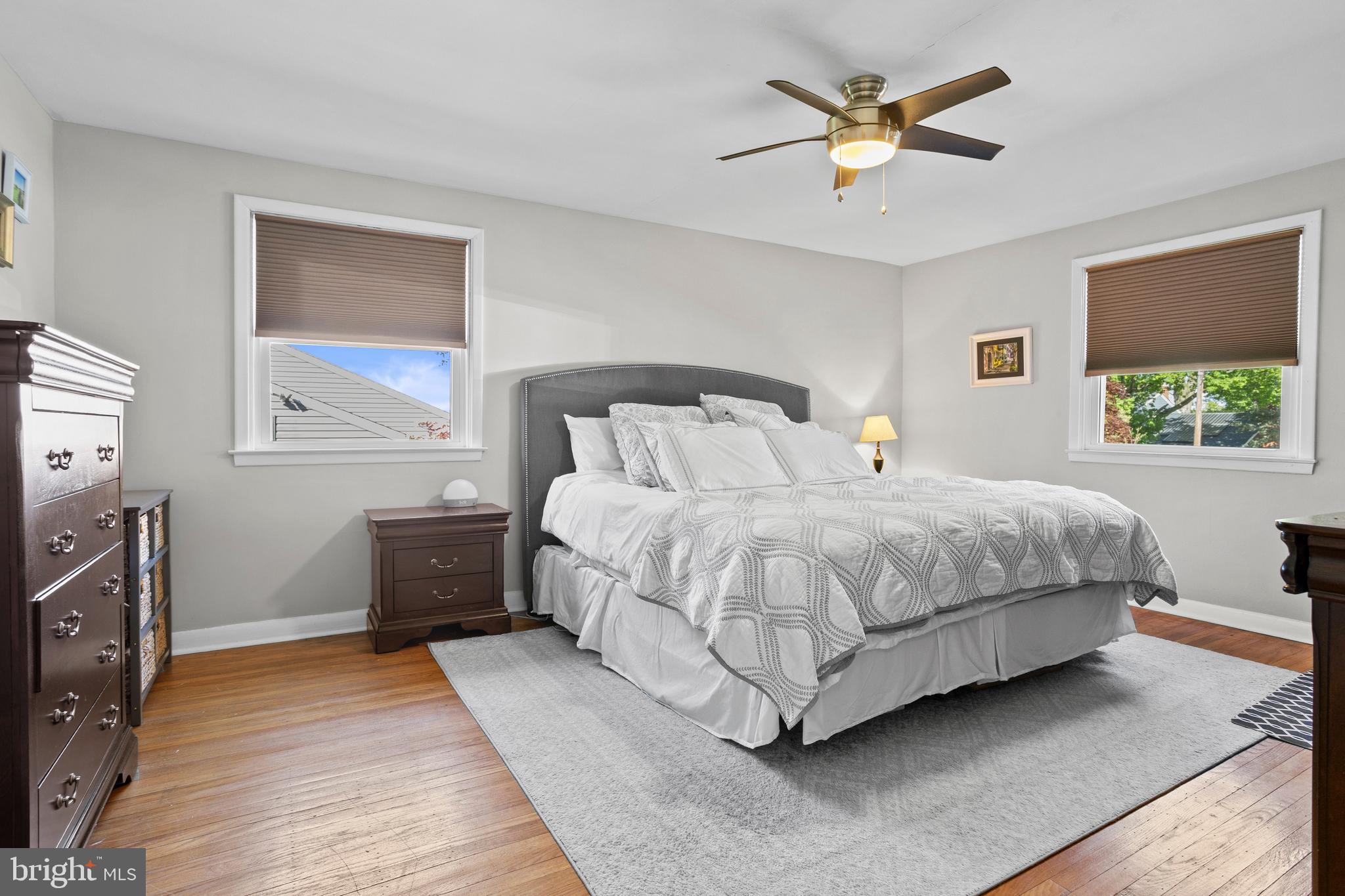 105 Longview Drive Springfield, PA 19064 - Photo 16 of 33 a bedroom with a bed and a chandelier