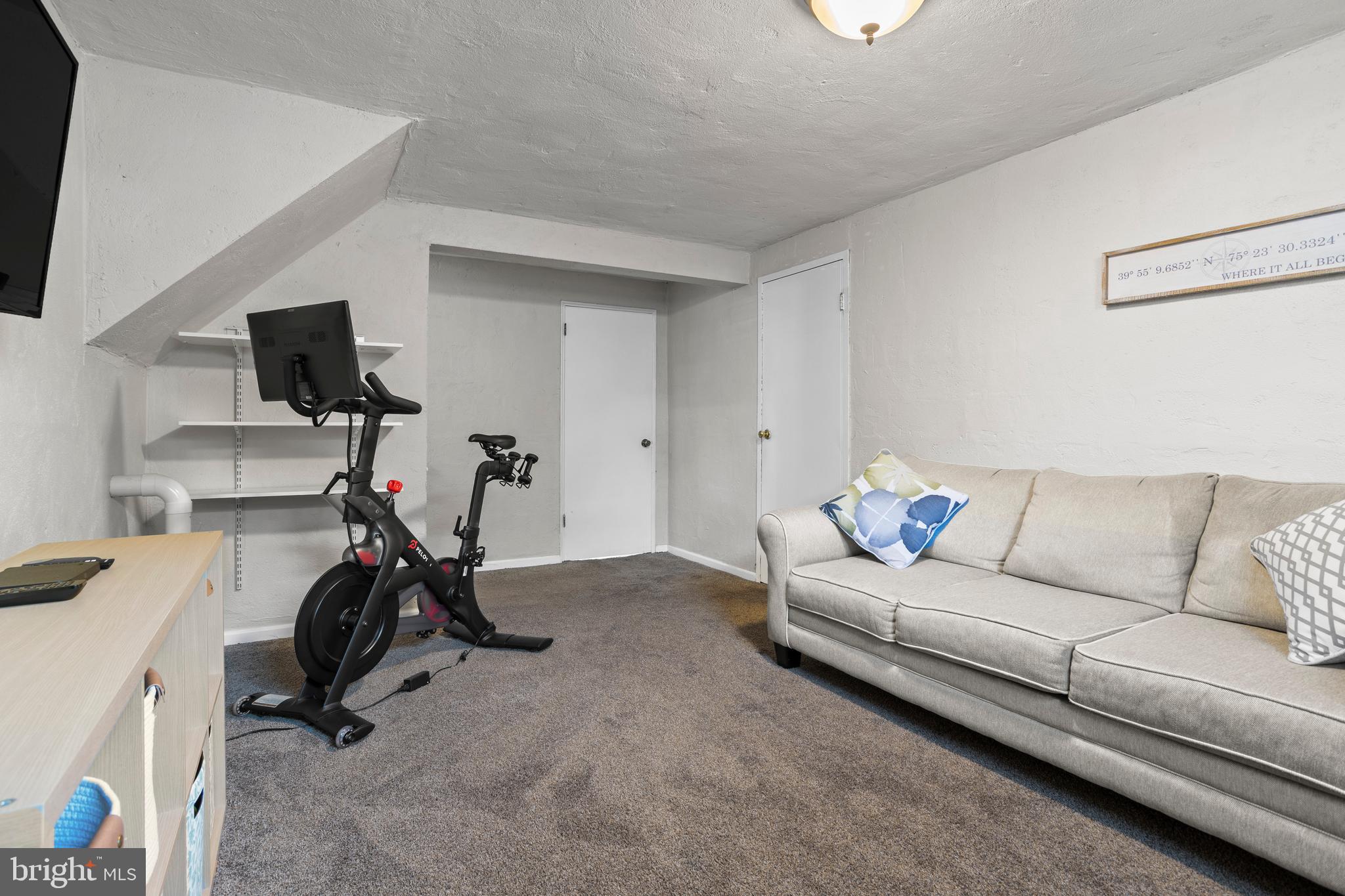 105 Longview Drive Springfield, PA 19064 - Photo 23 of 33 a living room with furniture and a flat screen tv