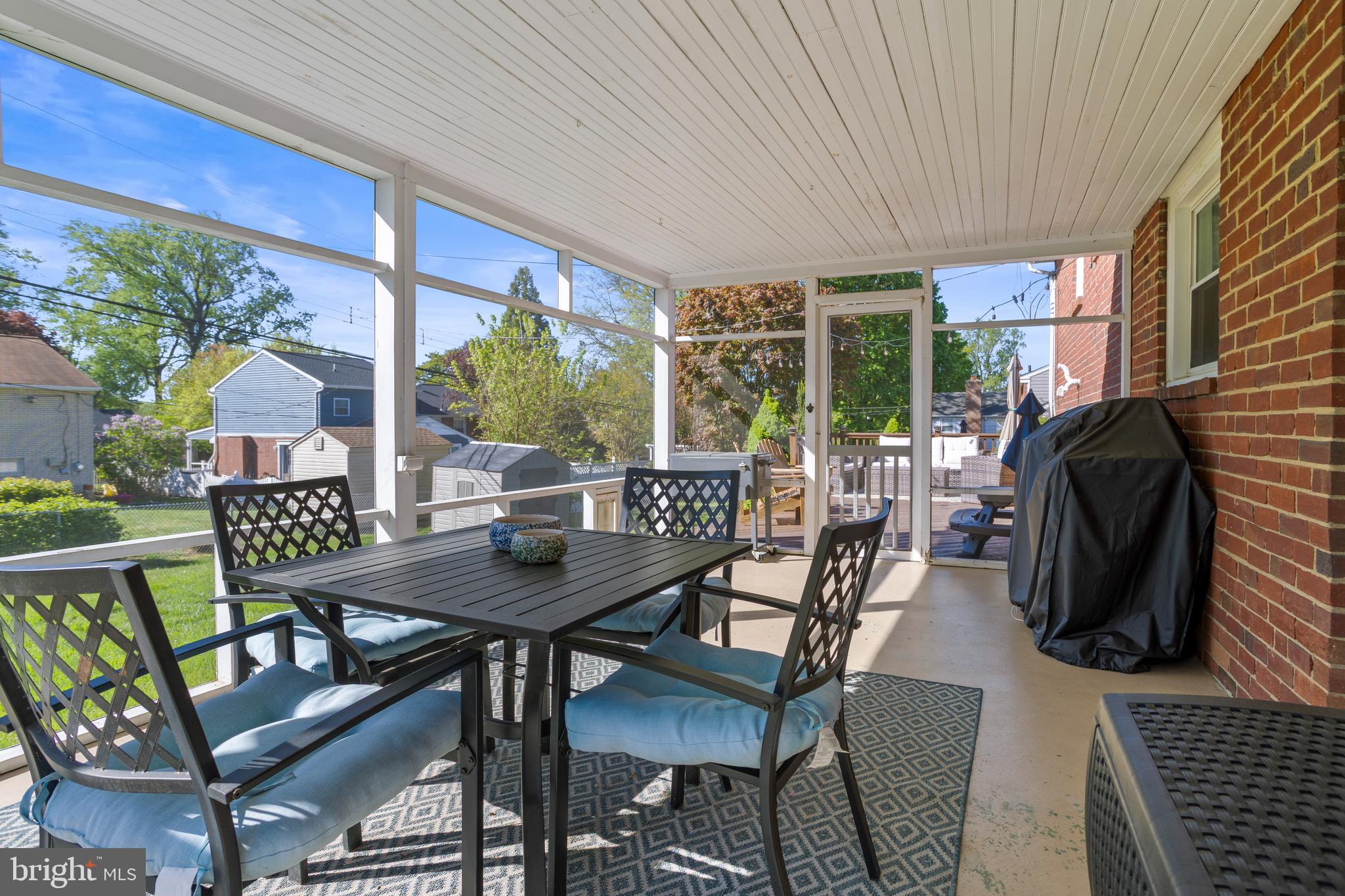 105 Longview Drive Springfield, PA 19064 - Photo 26 of 33 a view of a patio with a table and chairs
