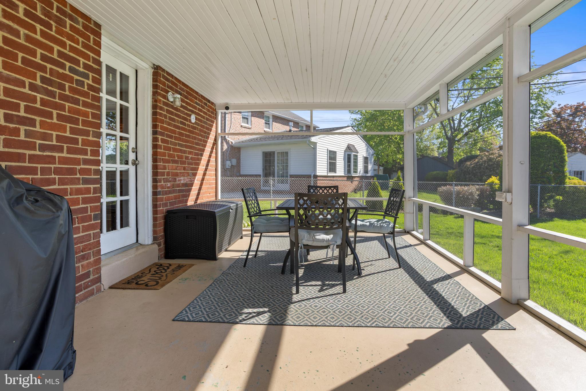105 Longview Drive Springfield, PA 19064 - Photo 27 of 33 a view of a patio with a table and chairs