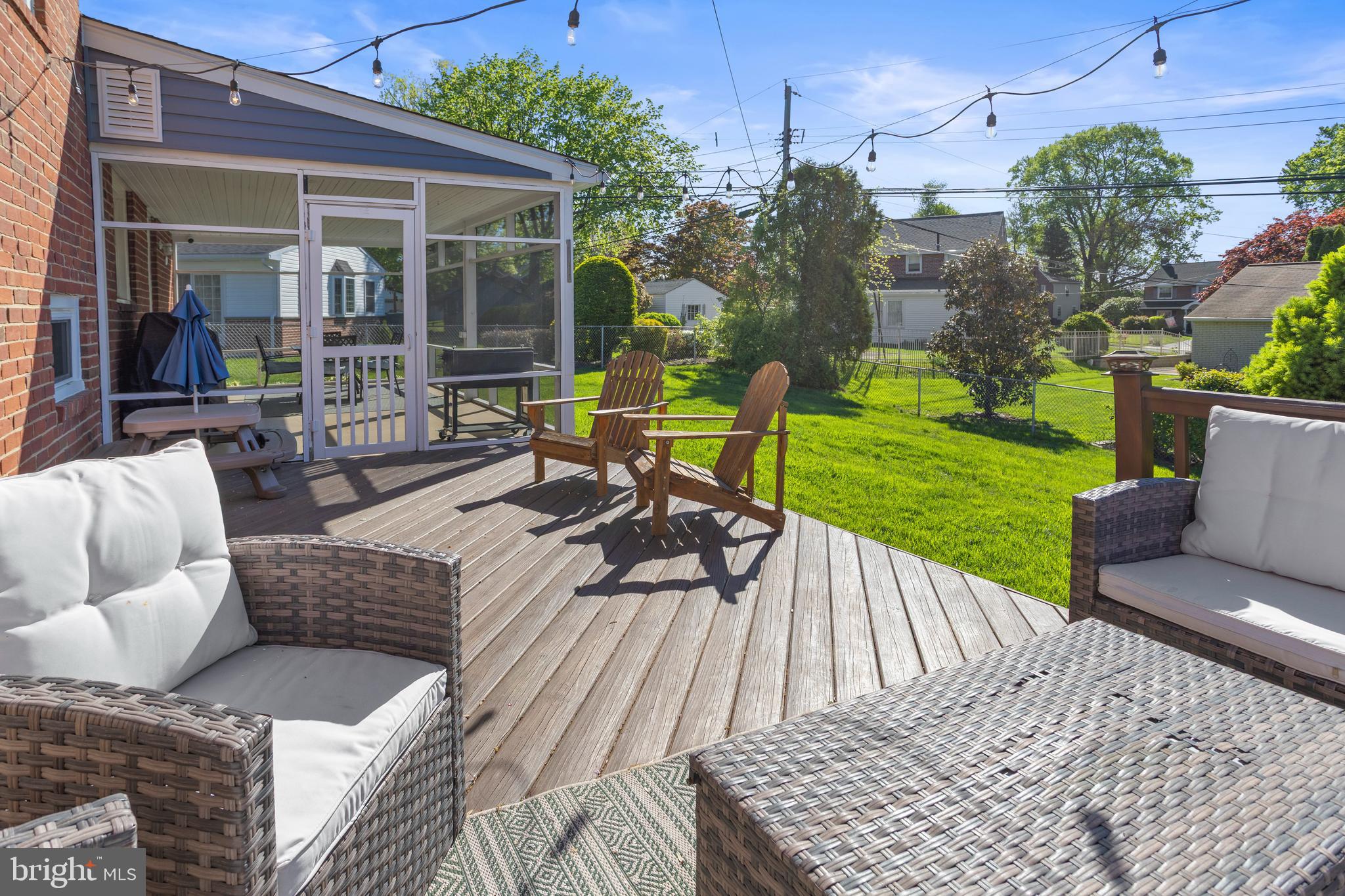 105 Longview Drive Springfield, PA 19064 - Photo 28 of 33 a view of a patio with couches chairs and a yard