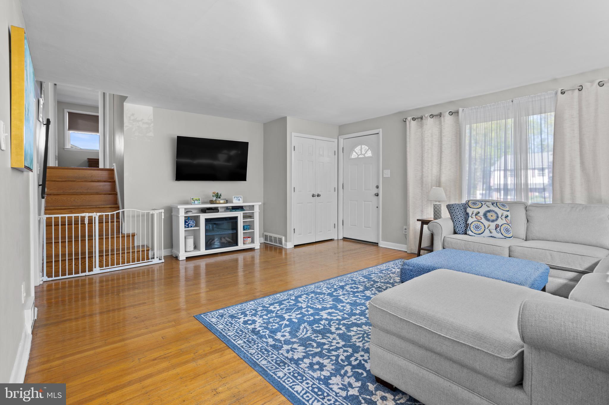 105 Longview Drive Springfield, PA 19064 - Photo 7 of 33 a living room with furniture and a flat screen tv