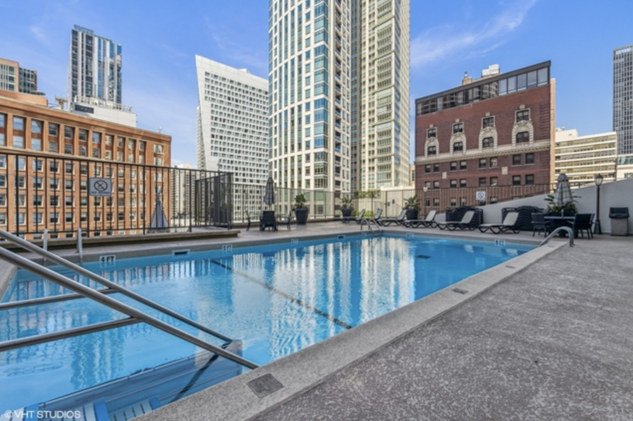 111 East Chestnut Street, Unit 22H Chicago, IL 60611 - Photo 22 of 27 a view of balcony with a swimming pool
