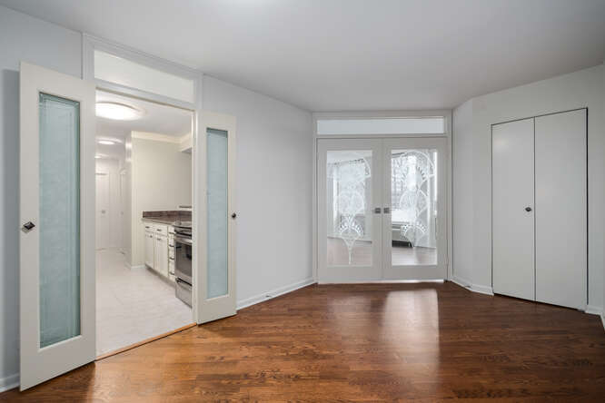111 East Chestnut Street, Unit 22H Chicago, IL 60611 - Photo 10 of 27 a view of empty room with wooden floor