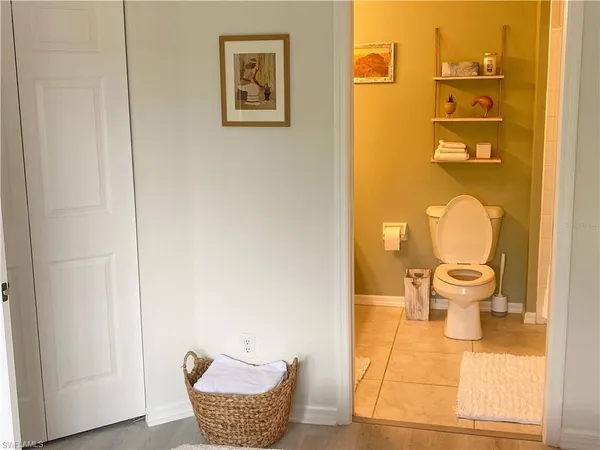 a wooden bench sitting in front of a door