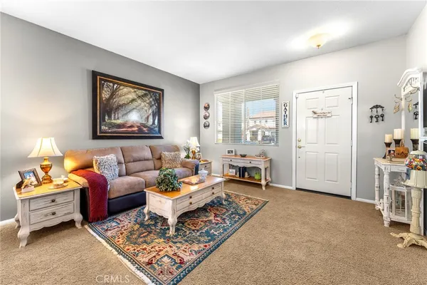a living room with furniture and a rug