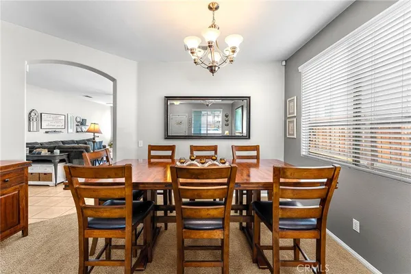 a dining room with furniture and window