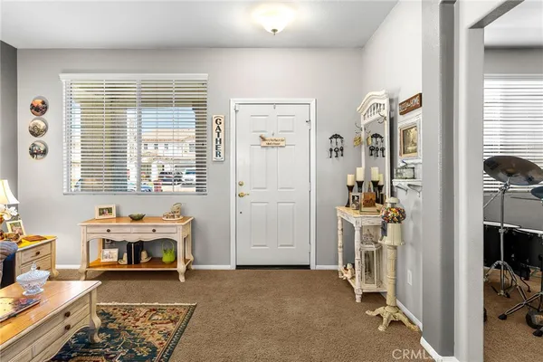 a bedroom with furniture and a window